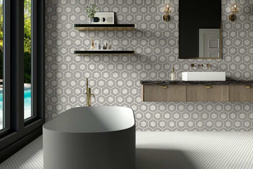 black and white hexagon backsplash in maximalist bathroom with black deep soak tub and penny tile floors